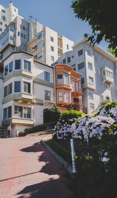 A vertical shot of modern apartments at daytime